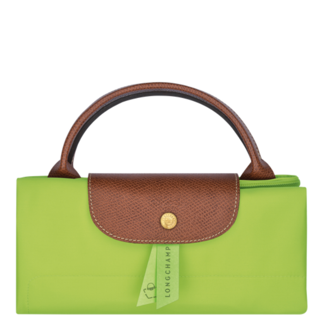 Grand sac de voyage en toile et cuir LONGCHAMP gamme Le Pliage Original couleur vert clair