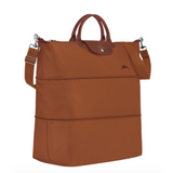 Sac de voyage extensible en toile et cuir LONGCHAMP gamme Le Pliage Green couleur marron cognac